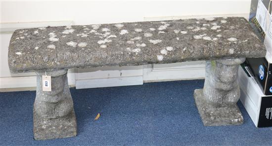 A stone garden bench, W.105cm